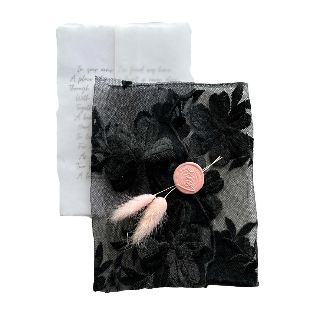 Black fabric envelope with letter, 5 x 7 in.