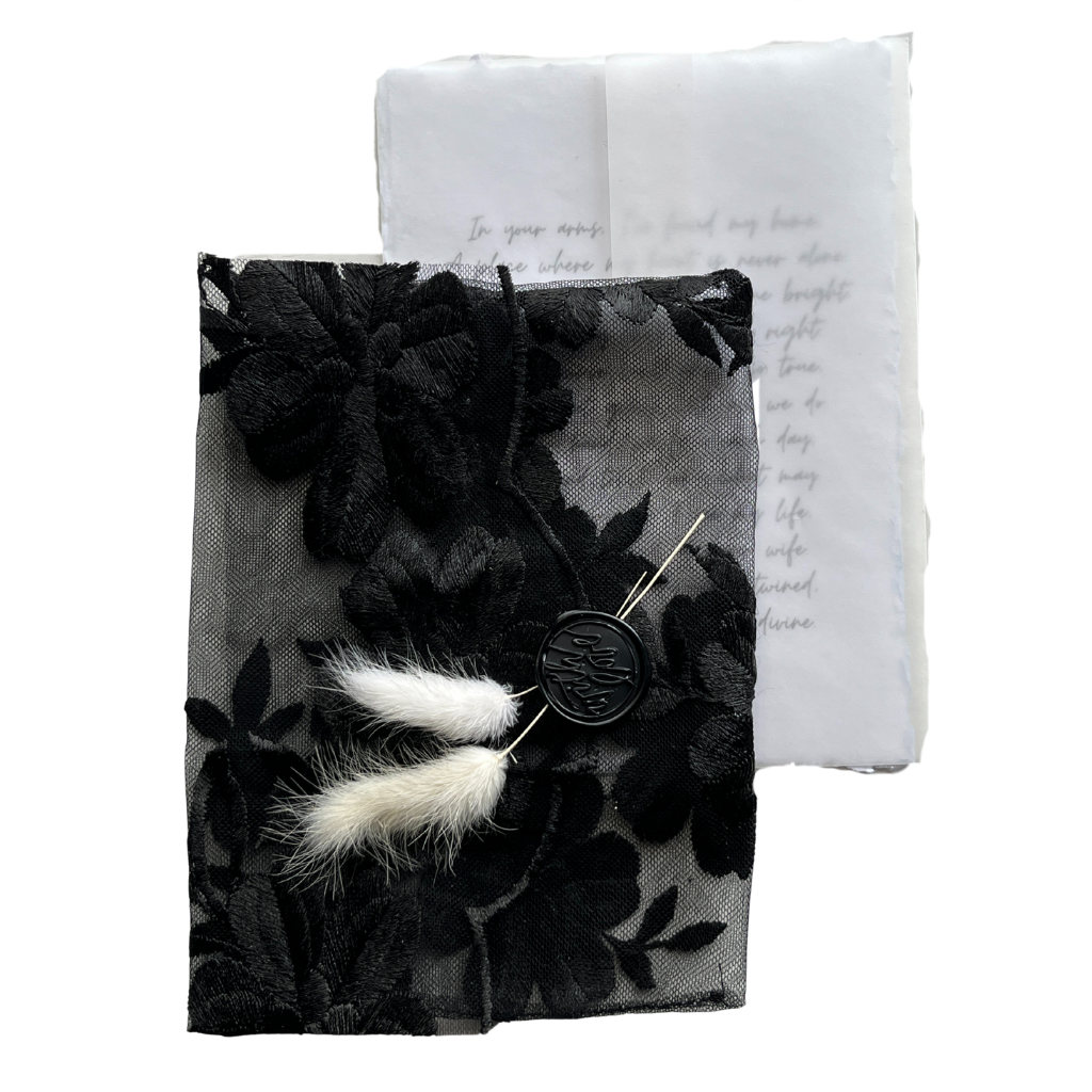 Black fabric envelope with letter, 5 x 7 in.